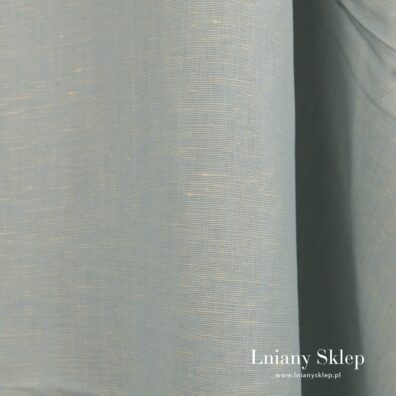 Gładko wytkana zielonkawa tkanina.