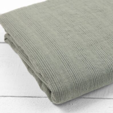 Pprześcieradło zielone w paski z dekatyzowanego lnu 100%.