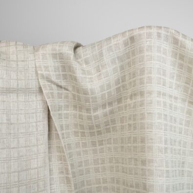 Żakardowa tkanina lniana w piaskową kratkę.