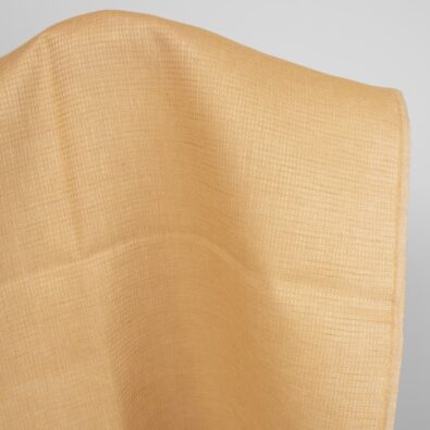 Żółta w brąz waflowa tkanina lniana.