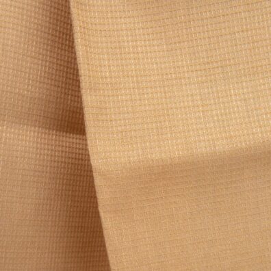 Tkanina wytkana w melanżu z dwóch żółtych (pszenica i wanilia) przędz.