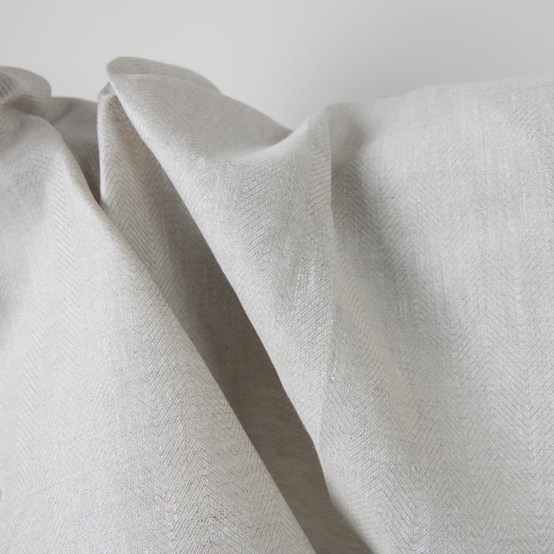 Szara tkanina lniana wytkana w jodełkę