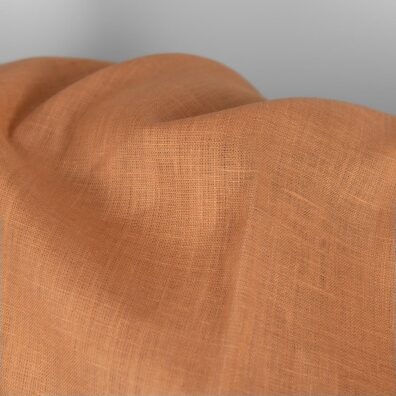 Gładko wytkana jasnobrązowa tkanina lniana