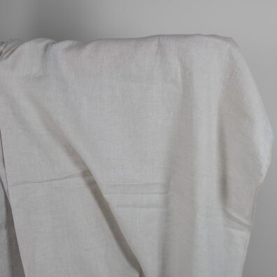 Vaaleanharmaa pellavakangas jossa on rombikuvio