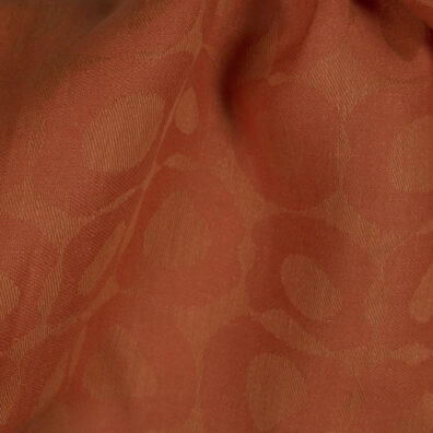 Pellavakangas oranssi jacquard jossa on ympyräaiheinen kuvio vaatteiden ja kodintekstiilien ompeluun