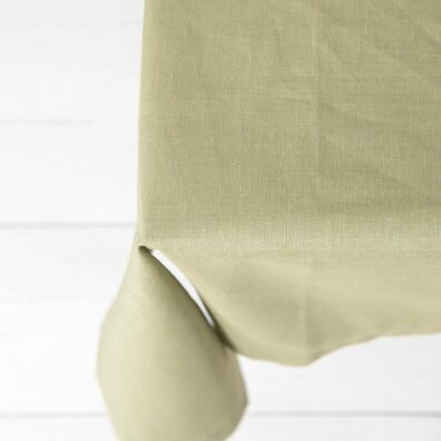 Puolipellava vihertävä pöytäliina, käännettävä helma 4cm leveä