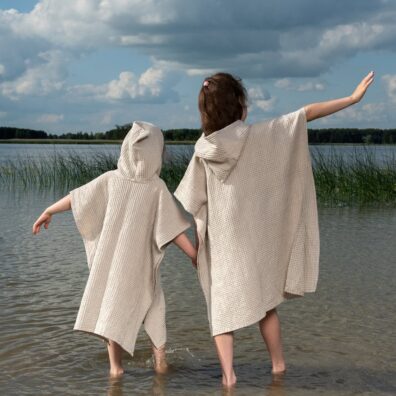 Puolipellava poncho beige hupulla