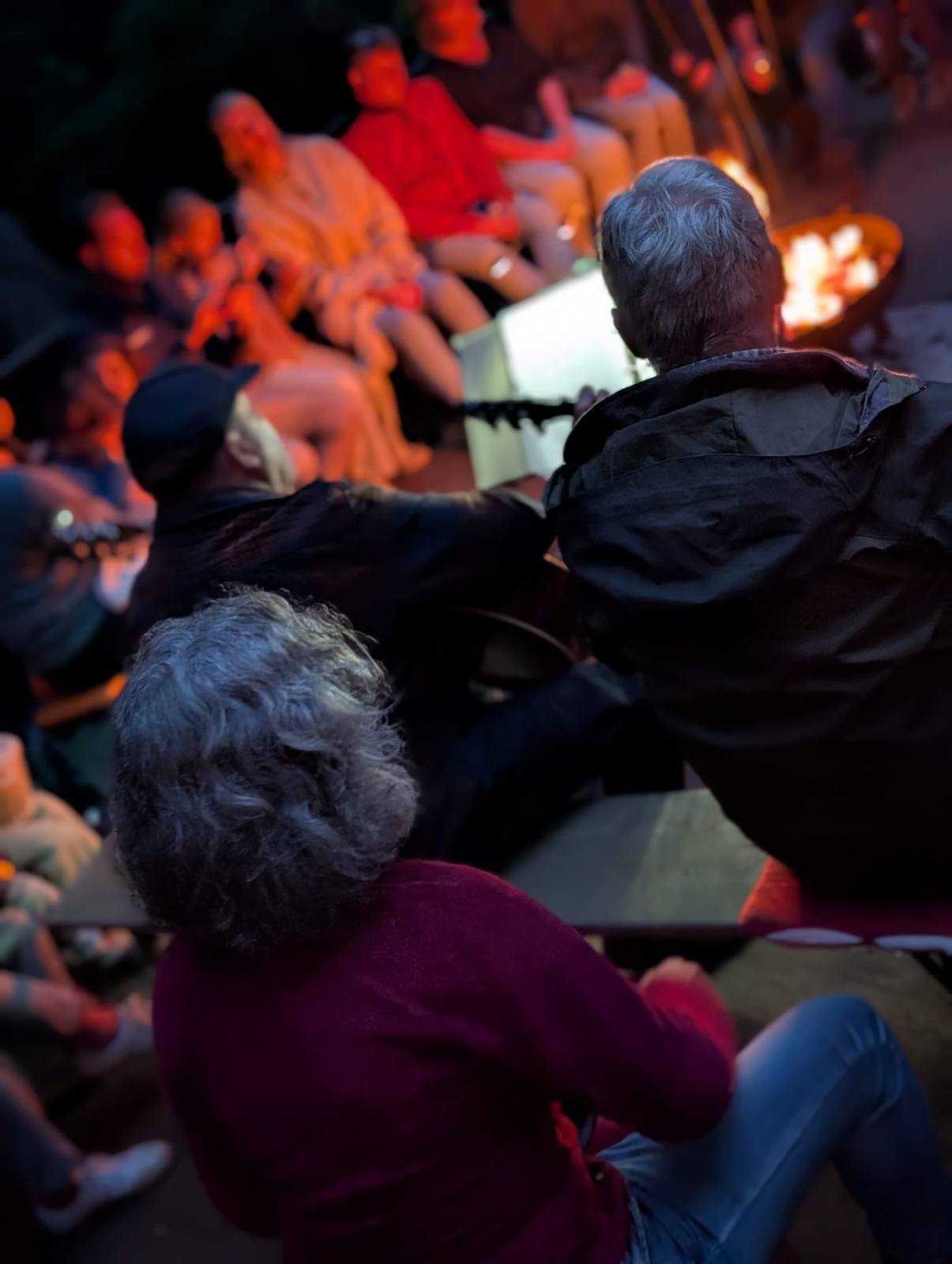 Campfire evening with guitar playing