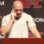 Dana White using a flip-phone