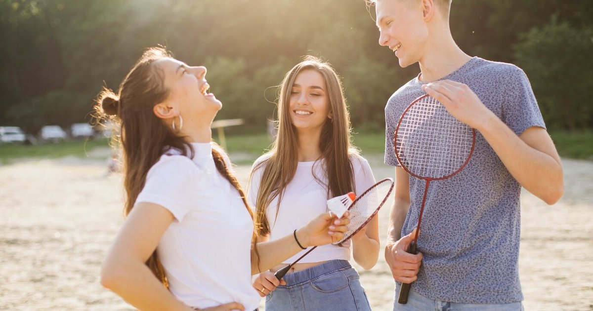 medium-shot-laughing-friends-standing-outdoors_23-2148262396