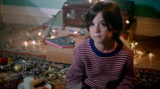McCann Portal Inocencia ALDI campaign website showing kid in Christmas