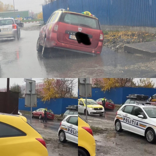Taxi blocat într-o groapă adâncă pe strada Termocentralei din Târgu Jiu