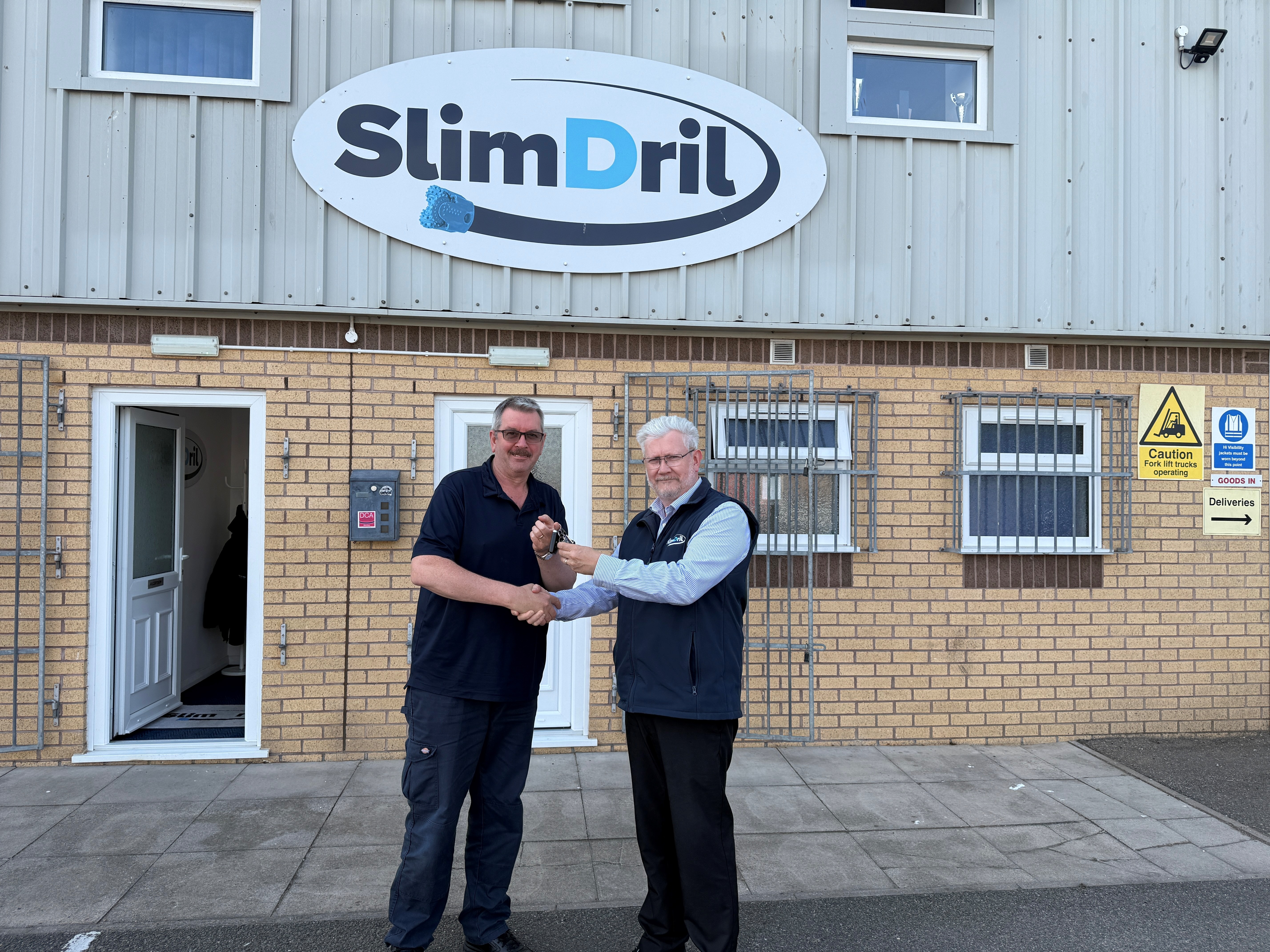 Taff (left) and John (right) shaking hands