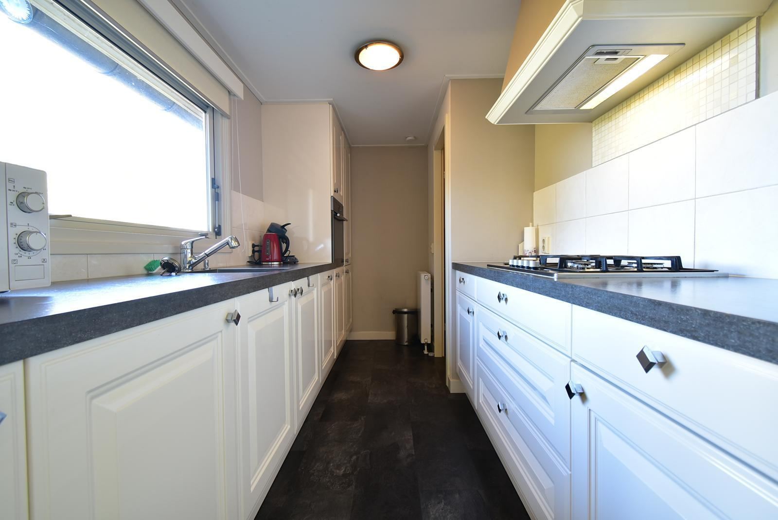 kopen-vrijstaand-vakantiehuis-kattendijke-tuin-aan-water-ligstoelen-vakantiehuistekoop-nl.jpg018.jpg