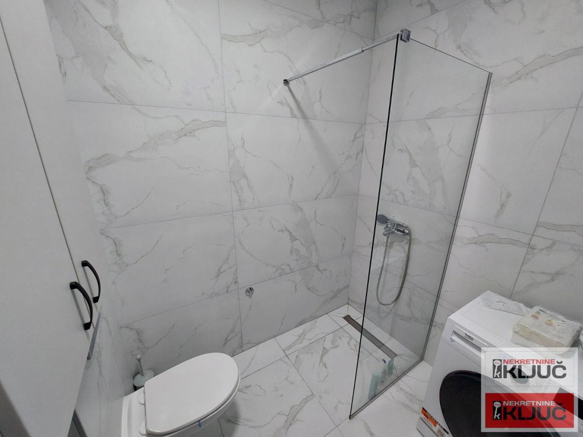 AVIJATIČARSKO NASELJE IZDAJE JEDNOIPOSOBAN MODERNO OPREMLJEN STAN SA GARAŽNIM MESTOM 12