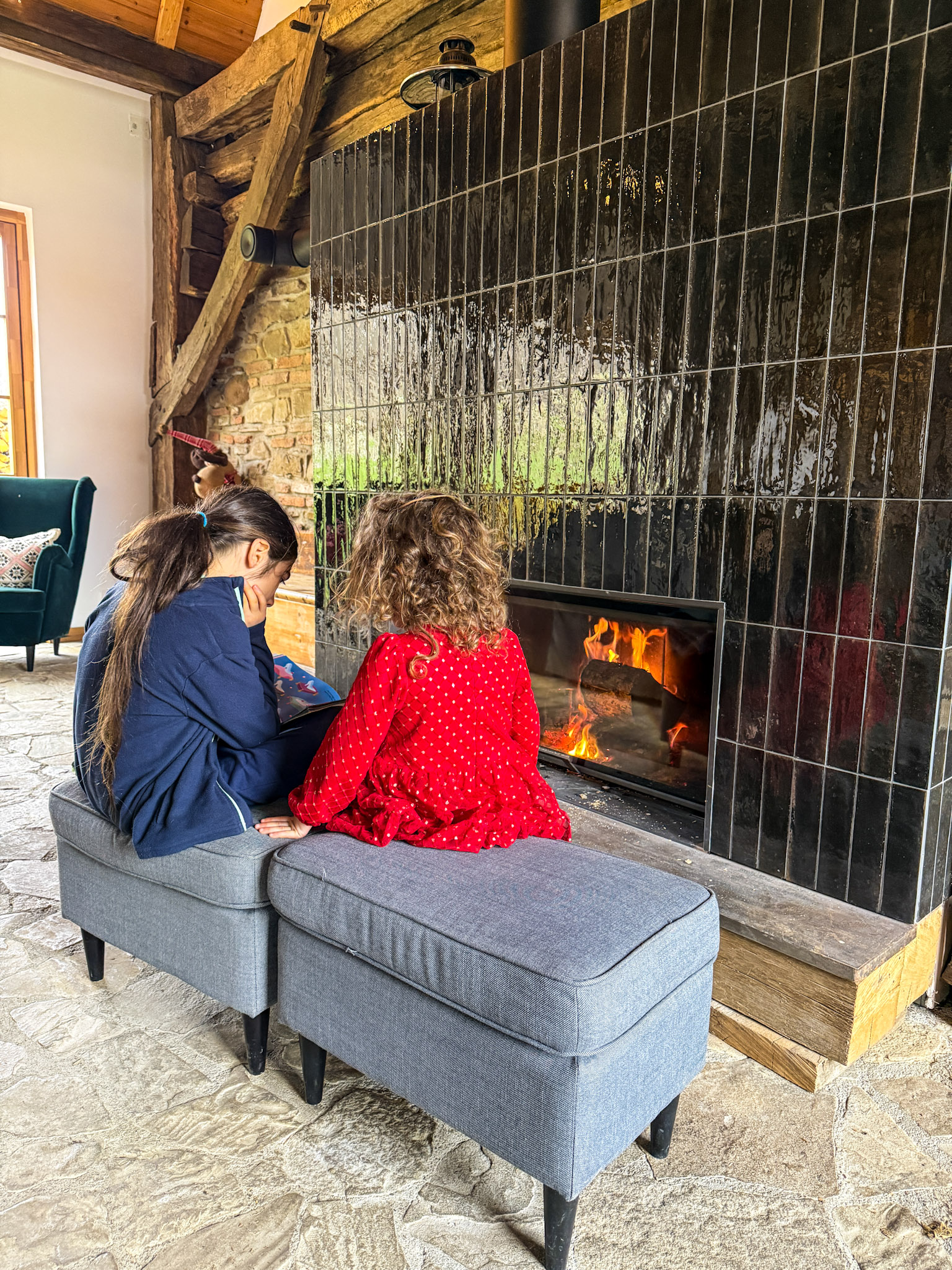 kids reading around the fire