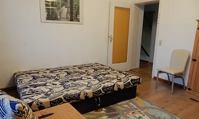 Schlafraum 2 mit Doppelstockbett und ausgezogener Schlafcouch