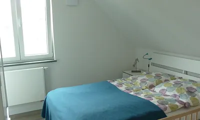 Schlafzimmer 2 mit Gitterbett Wohnung 4