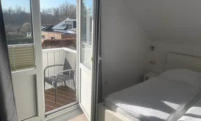Schlafzimmer mit Balkon