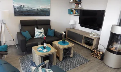 Gemütlicher Sitzbereich mit Kaminofen