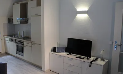 Wohnraum mit Fernseher, CD Player, Telefon und kostenfreiem WLAN