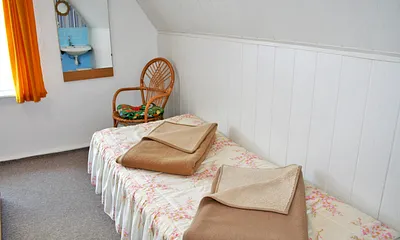 Einzelbett für eine dritte mitreisende Person im Schlafzimmer