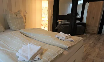 Bett in Komforthöhe mit Topper