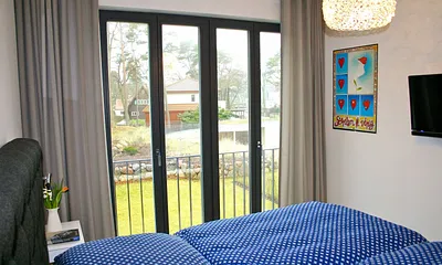 Strandvilla Andrea WE 07 - 1. Schlafzimmer mit TV