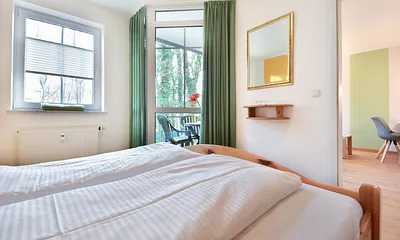 Schlafzimmer mit Balkonzugang