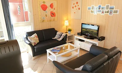Ferienhaus Sandkörnchen - Couch- und TV-Bereich