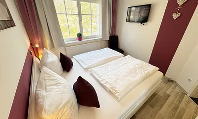 Villa Wilhelmine WE 04 Schlafzimmer mit TV