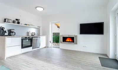 Wohnzimmer mit Küche und Bio-Kamin