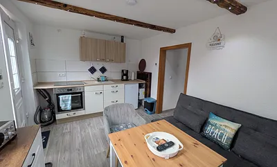 Wohnzimmer mit Küchenzeile 