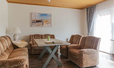 Wohnzimmer mit Zugang zur Terrasse