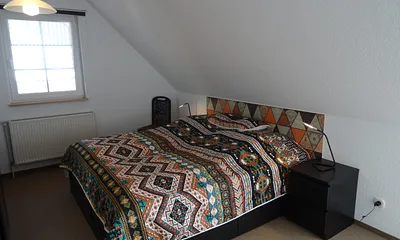 Schlafzimmer 1 mit Doppelbett