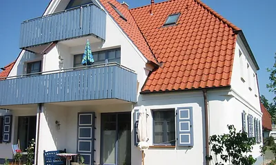 Die Gartenansicht mit sonnigem Süd-West-Balkon im 1. OG