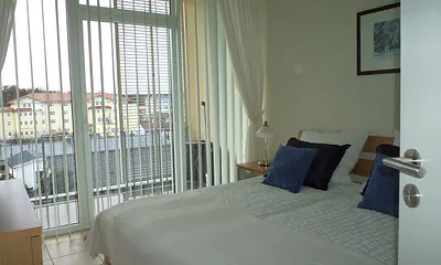 Schlafzimmer mit Balkon
