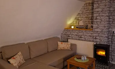  Eckcouch im Wohnzimmer, die auch als Aufbettung genutzt werden kann.
