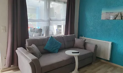 Wohnzimmer mit Schlafcouch 180 x 200 mit Topper