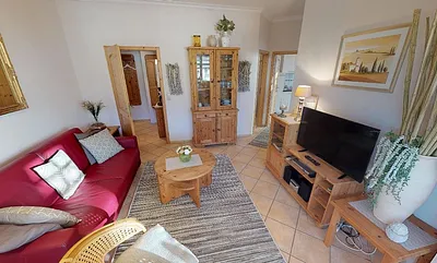 Wohnzimmer mit LCD-Fernseher, Stereoanlage und DVD-Player