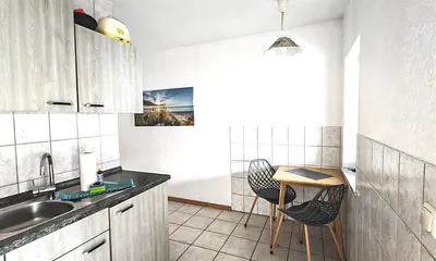 Es gibt einen Esstisch mit Sitzgelegenheiten nebst Hocker für eine 3.Person