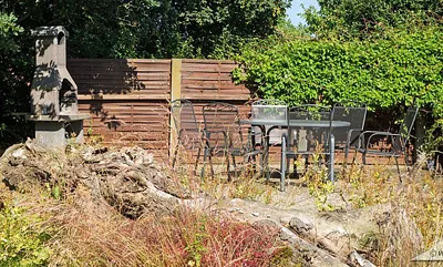 Der Blick auf eine unserer Terrassen mit Grill