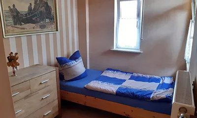 Zweites Schlafzimmer in der 1. Etage mit zwei Einzelbetten