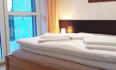 Schlafbereich/Zugang zum Balkon