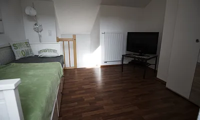 Mansardenzimmer mit Ausziehbett
