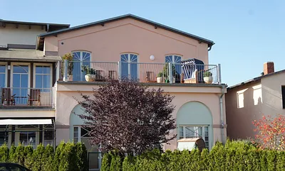 Süd-Ost Dachterrasse mit Strandkorb und gemütlichen Teakholzmöbeln