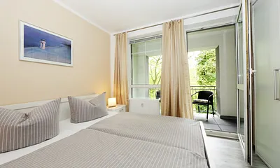 Schlafzimmer mit Balkon