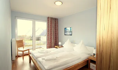 Schlafzimmer mit Balkon