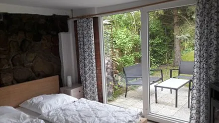 Ferienhaus mit Terrasse und Gartenanteil