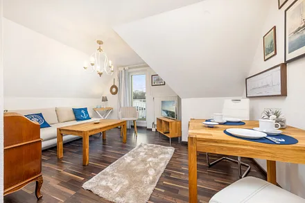 Das Wohnzimmer mit TV und kostenfreiem WLAN.